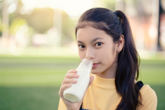 asian-girl-is-drinking-delicious-bottle-milk-dairy-joy-malaysia